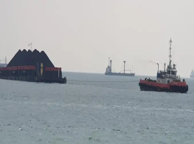 Moments before one of our set of tug-and-barge ships arrive at a port.