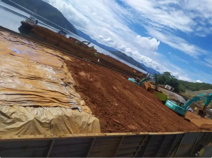 Loading process of nickel ore into our barge.